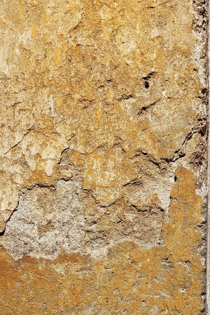 A close up of the surface of an old wall.